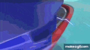 a blue and red car with a lightning bolt coming out of it 's bumper .