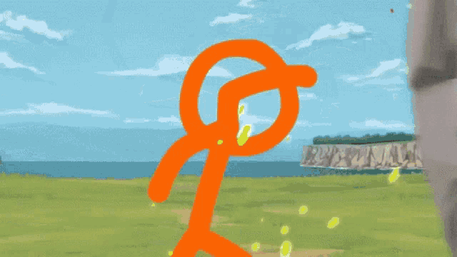a close up of a rock wall with a grassy field in the background