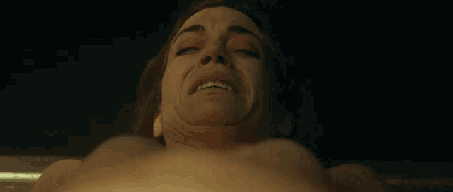 a close up of a person 's face with their eyes closed