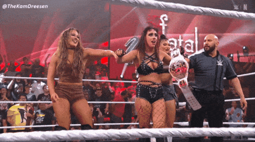 two women in a wrestling ring with the hashtag thekamdreesen on the bottom right