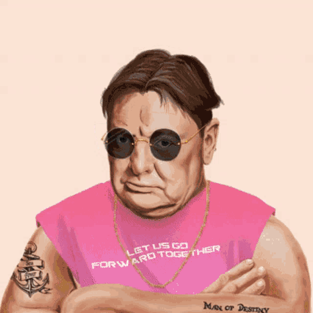 a man with a tattoo on his arm is wearing a black shirt that says the end of the beginning