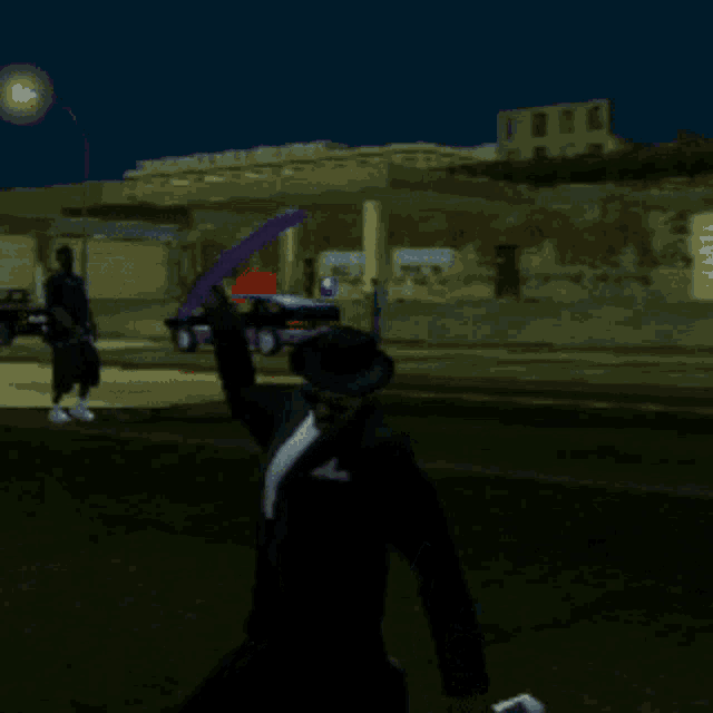 a man in a suit and hat is laying on the ground