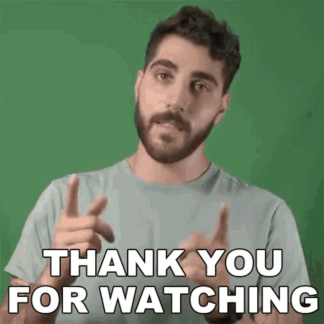 a man with a beard is giving a thank you for watching sign .