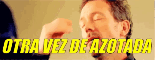 a man with his eyes closed and the words otra vez de azotada written above him
