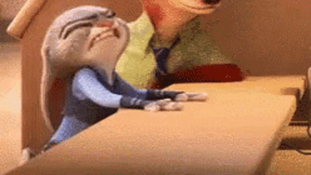 zootopia judy hopps and nick wilde are sitting at a table in a restaurant .