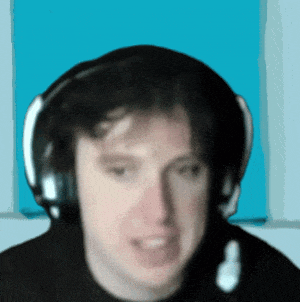 a blurry picture of a man wearing headphones and a black shirt