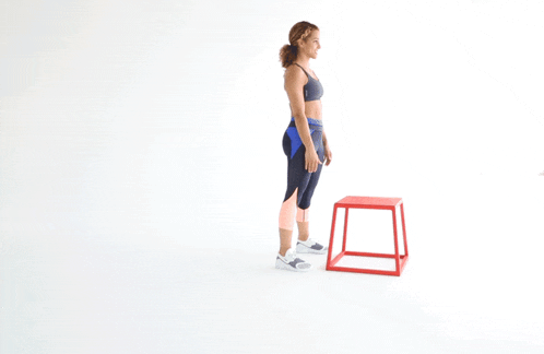 a woman is standing next to a red box