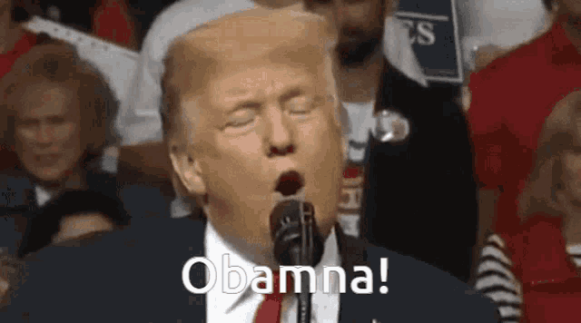 donald trump is yawning while speaking into a microphone at a campaign event .