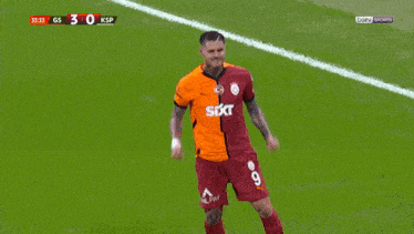 a soccer player with the number 45 on his back is hugging two other players
