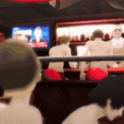 a blurred image of a bar with a man in a tuxedo behind a fence