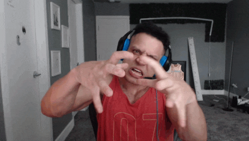a man wearing headphones and a red shirt with the number 07 on the front