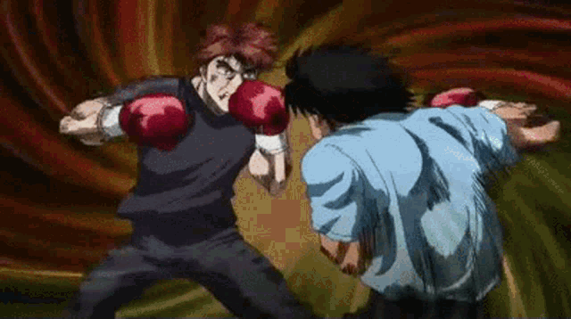 a man wearing boxing gloves is fighting another man in a blue shirt