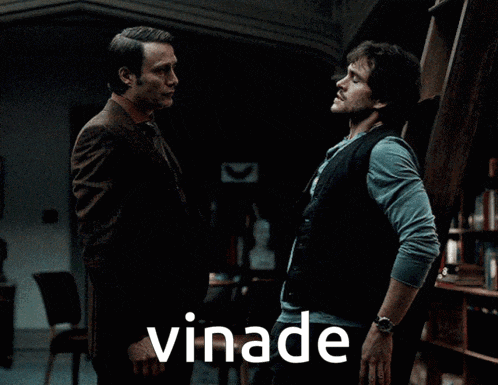 two men are standing next to each other and the word vinade is on the bottom