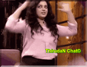 a woman in a white shirt is dancing in front of a sign that says thiruda n chat