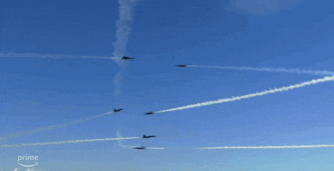 several planes are flying in a blue sky with the word prime on the bottom