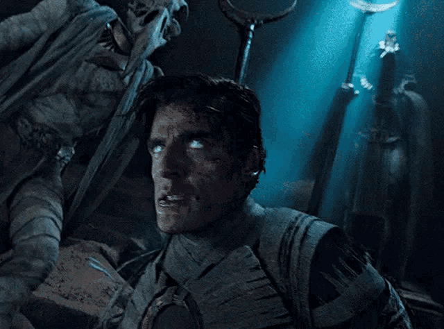 a man in a mummy costume has his eyes glowing