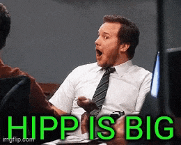 a man in a white shirt and tie is sitting at a table with his mouth open and the words hipp is big written in green