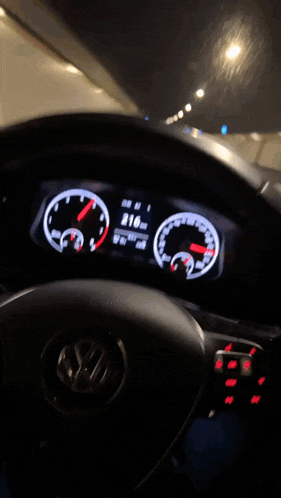 a volkswagen car is driving down a highway at 2:16