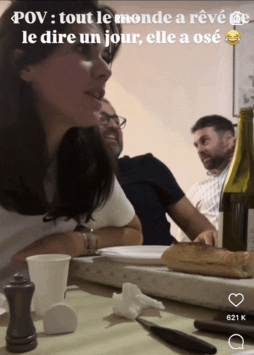 a woman sitting at a table with a caption that says pov tout le monde a reve le dire un jour elle a ose