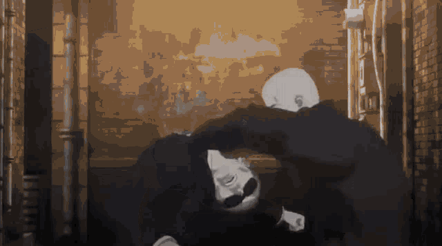a man with a mustache is laying on the ground in a dark alleyway .