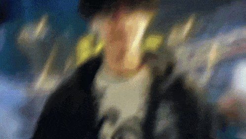 a blurry picture of a person 's face with a blurred background