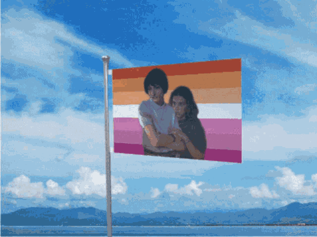 a flag with a picture of a man and woman on it