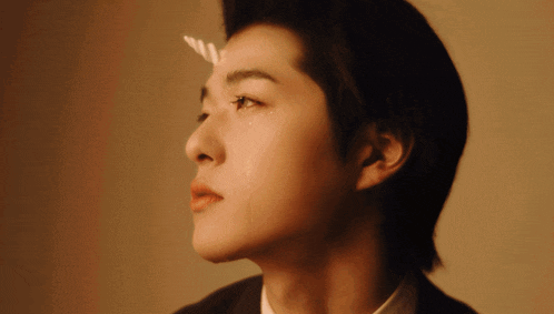 a man with a tear coming out of his eye