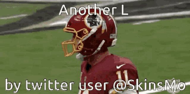 a football player wearing a red helmet with the number 11