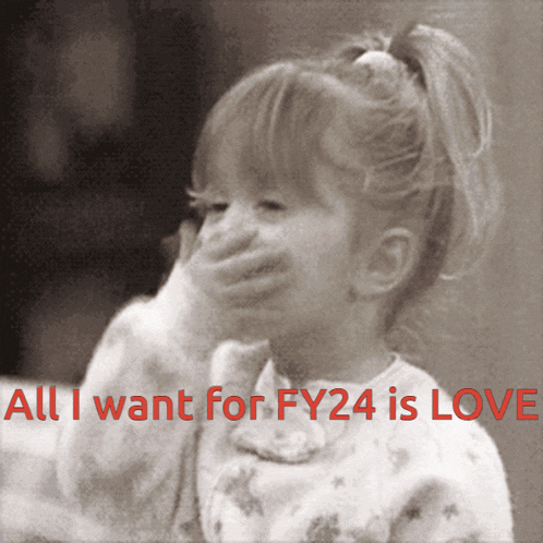 a little girl covering her mouth with her hand and the words " all i want for fy24 is love " below her