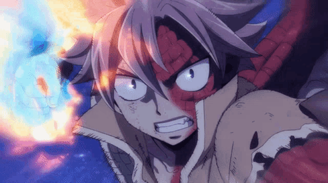 a close up of a person 's face with fire coming out of his mouth