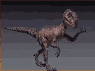 a statue of a dinosaur with its mouth open is standing on a table .