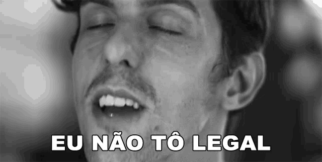 a black and white photo of a man with his eyes closed and the words eu não to legal above him