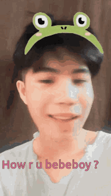 a man wearing a frog headband says how r u bebeboy ?