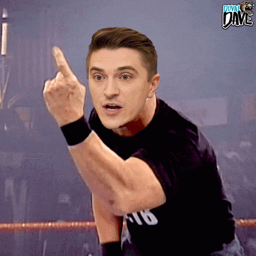 a man in a black shirt giving the middle finger with the word dave behind him