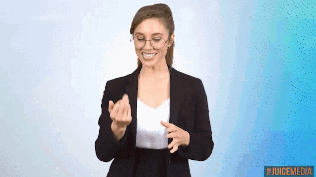 a woman wearing glasses and a black jacket stands in front of a blue background with the juicemedia logo in the corner