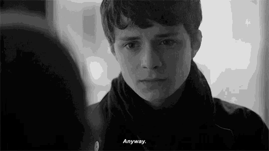 a black and white photo of a young man with a scarf around his neck and a quote .