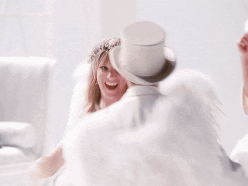 a woman with angel wings and a top hat