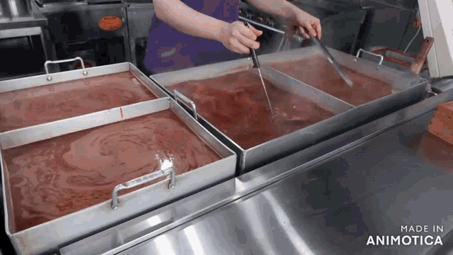 a person in a purple apron is stirring a tray of food in a kitchen made in animatica