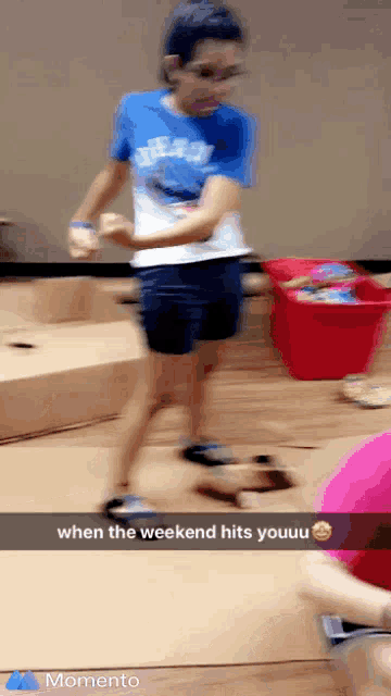 a girl in a sesame street shirt is dancing with a caption that says " when the weekend hits youuuu "