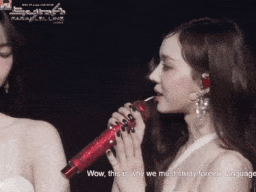a woman holding a red microphone with the words wow this is why we must study foreign language written below her