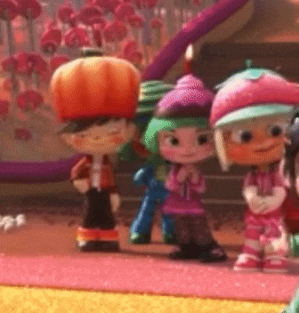 a group of cartoon characters are standing next to each other on a rug .