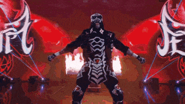 a man in a skeleton costume is standing in front of a sign that says ' rc ' on it