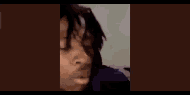 a person is taking a picture of themselves with a cell phone .