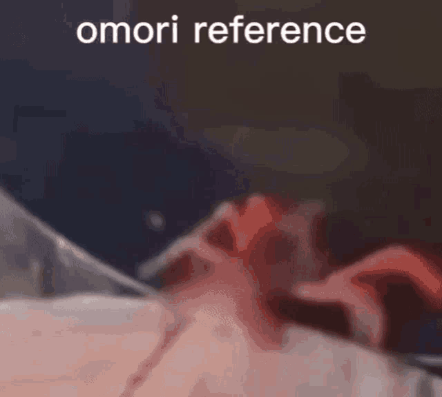 a close up of a person 's face with the words omori reference on the bottom