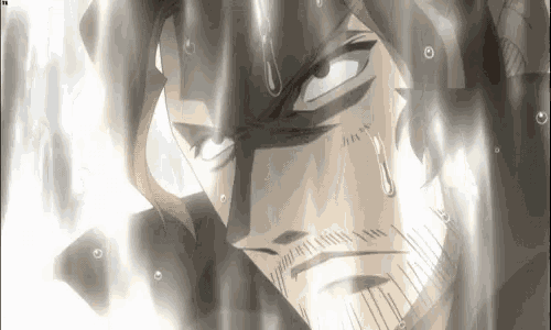a close up of a man 's face with tears coming out of it