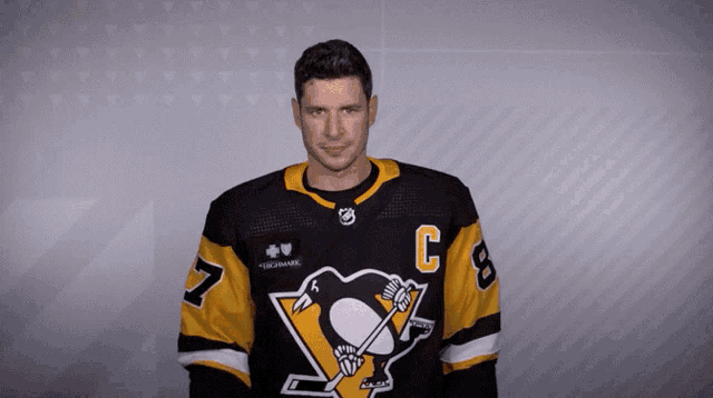 a man wearing a jersey with the letter c on it