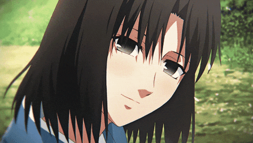 a close up of a girl with long dark hair