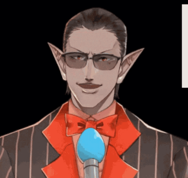 a man wearing glasses and a red bow tie holds a microphone
