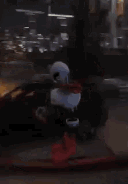 a cartoon character is standing on a sidewalk in a city at night .
