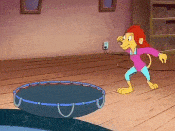 a cartoon monkey is standing next to a trampoline in a living room .
